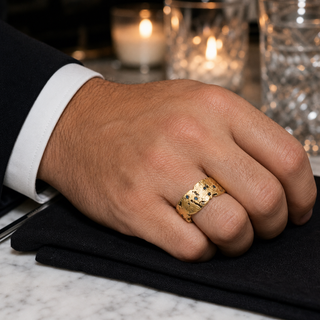 Gold Starfall Ring worn with a black suit at an evening table
