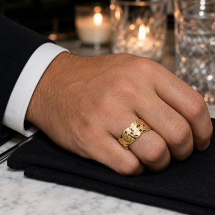 Gold Starfall Ring worn with a black suit at an evening table