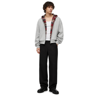 Model wearing the Counterform Crimson Reversible Hoodie on a white studio background
