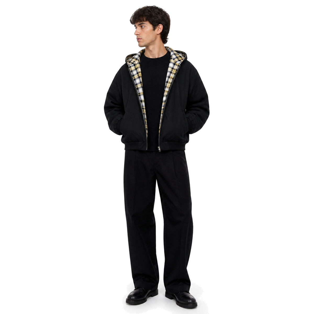 Model wearing the Counterform Noir Reversible Hoodie on a white studio background