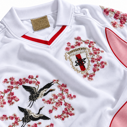 Close-up of embroidery on the Japan white-and-pink jersey
