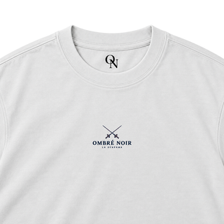 La Scherma Lunar Rock tee detail: collar, inner-neck mark and crossed-foil chest print