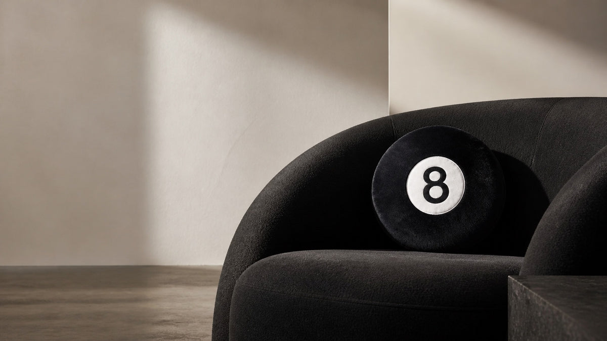 Black 8-Ball Pillow in a refined monochrome interior