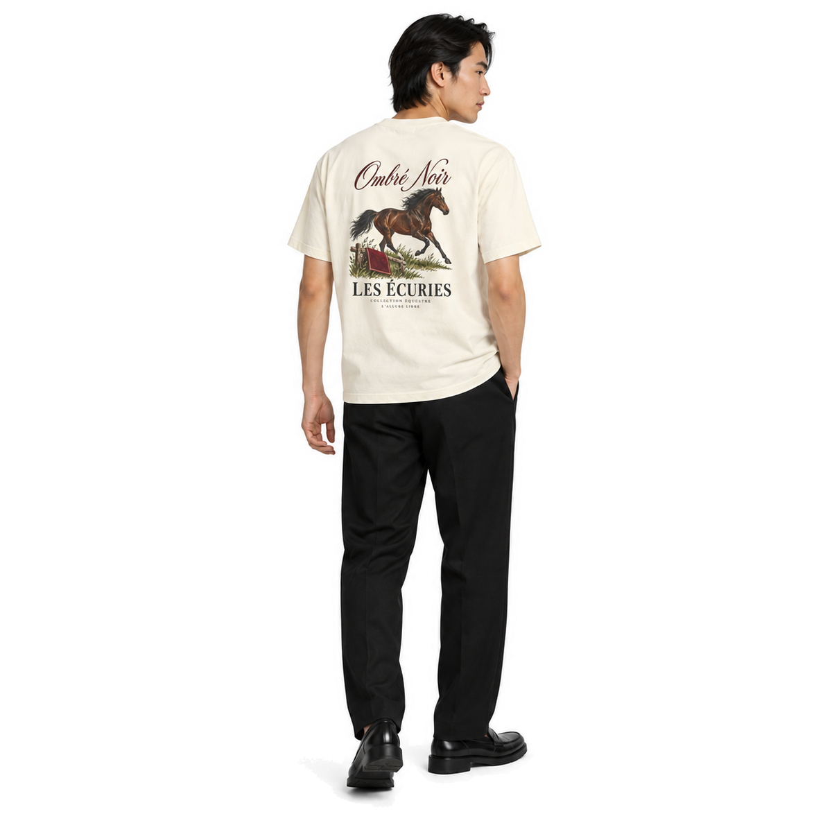 Male model wearing Les Écuries Graphic Tee in Faded Cream, back print visible