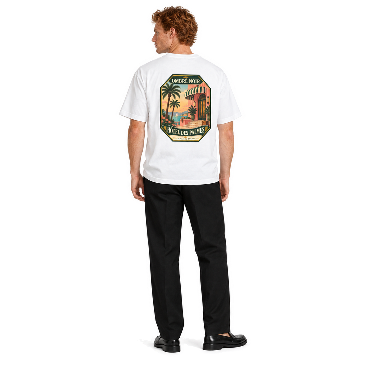 Male model wearing Hôtel des Palmes Graphic Tee in White, back print visible