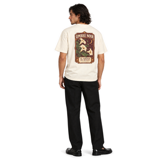 Male model wearing Le Jardin de Minuit Graphic Tee in Faded Cream, back print visible