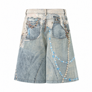 Fleur printed blue denim shorts, back pockets and trompe-l’œil chain print