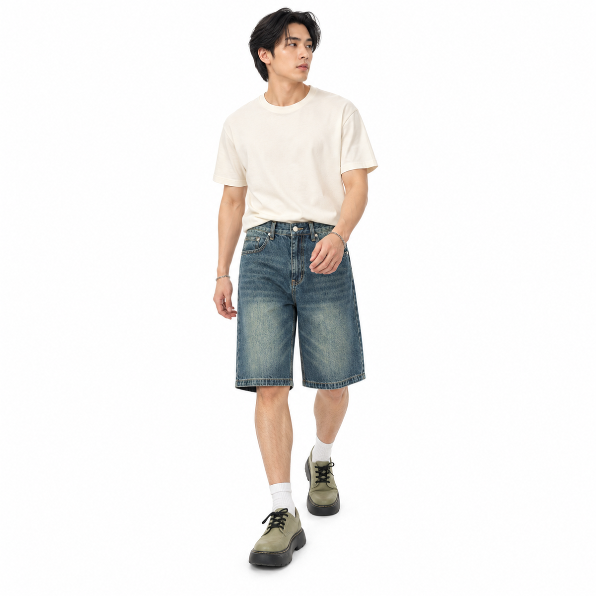 Model wearing Silt blue knee-length denim shorts