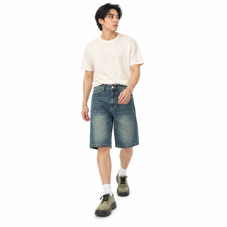 Model wearing Silt blue knee-length denim shorts
