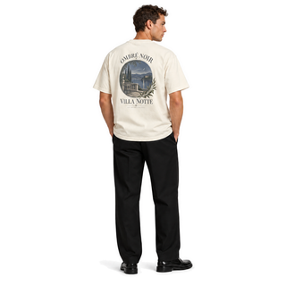 Male model wearing Villa Notte Graphic Tee in Faded Cream, back print visible