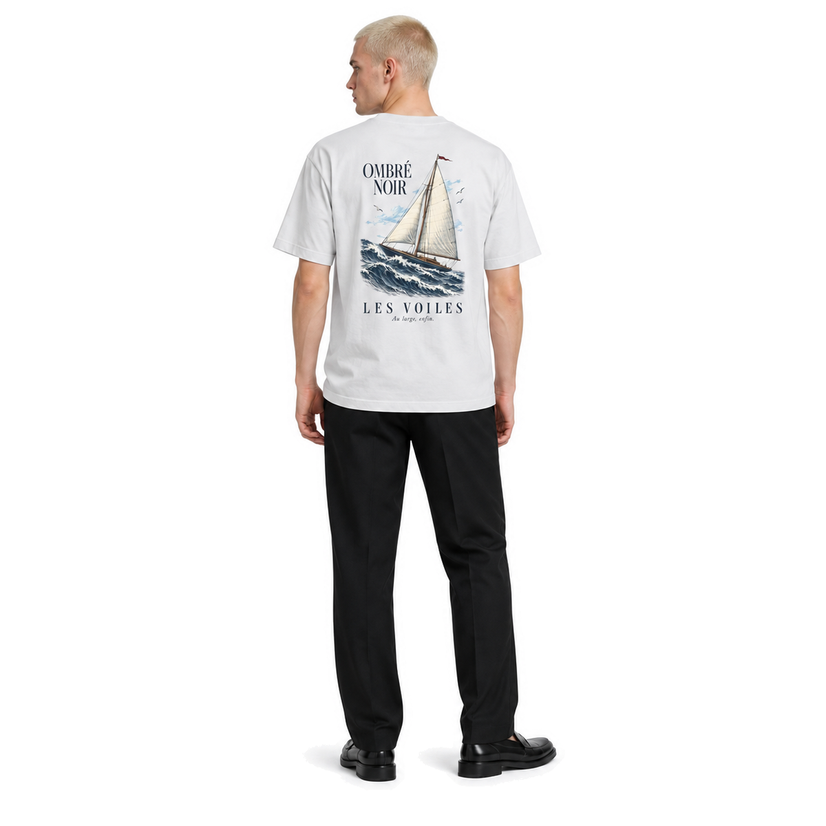 Male model wearing Les Voiles Graphic Tee in Lunar Rock, back print visible