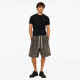 Model wearing Prowler loose leopard-print shorts