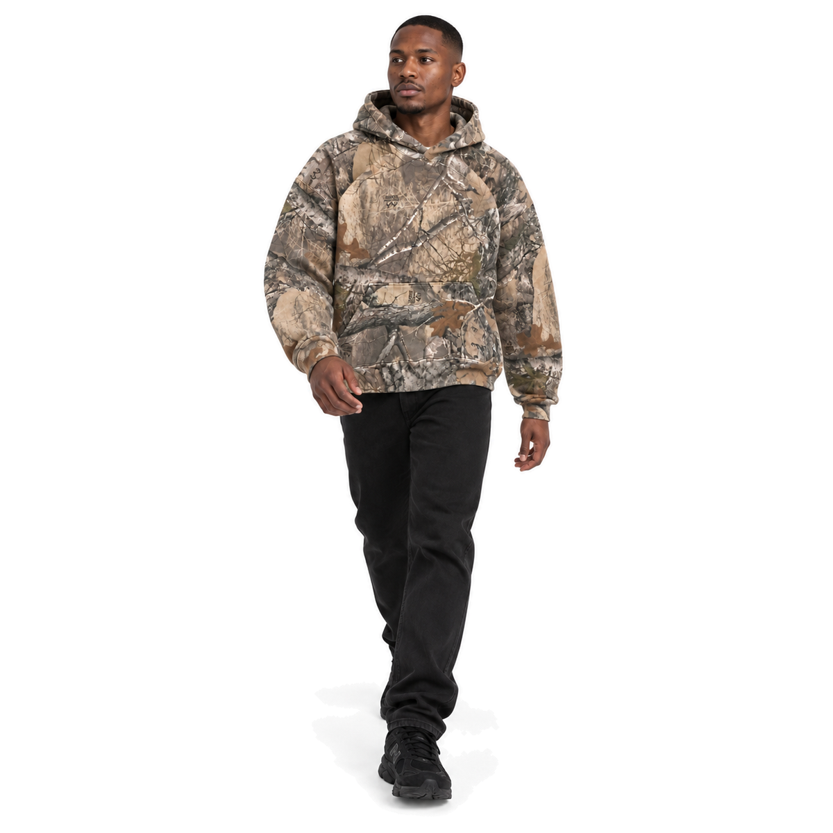 Underbrush Camo Pullover Hoodie in woodland camo, full-body model in a natural fashion pose on white
