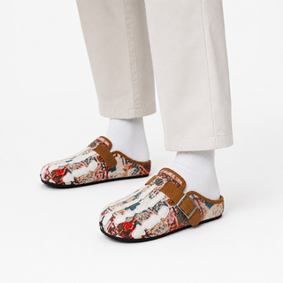 Model wearing Talisman Sand tapestry mules in a white studio