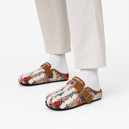 Model wearing Talisman Sand tapestry mules in a white studio