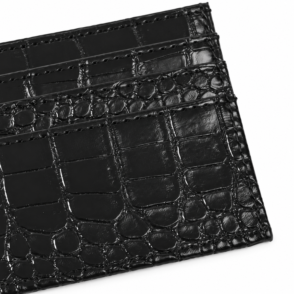 Tessera Croc Cardholder — Black, stitched front corner and card-slot edges close-up