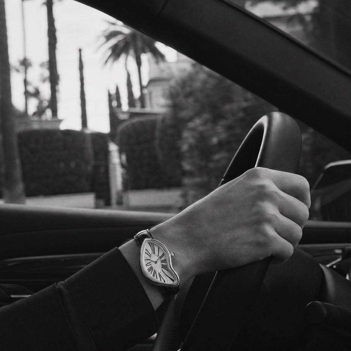 Black and white driving scene with the watch